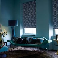 Blue patterned blackout roller blinds in living room