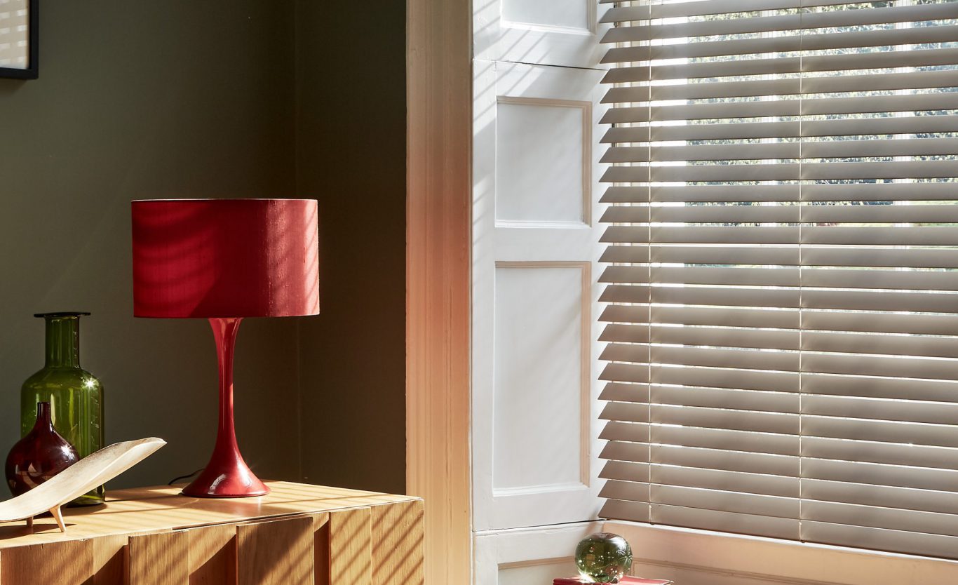 Faux wood blinds in study