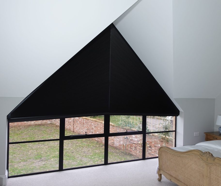 Triangle window blinds in bedroom