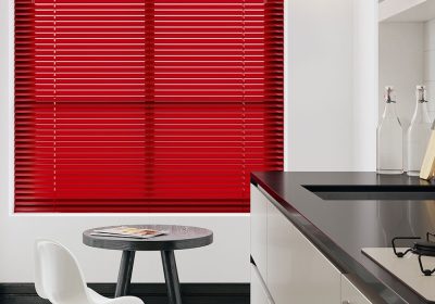 Red venetian blinds in kitchen