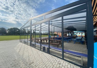 Commercial veranda with side panels covering outdoor eating area