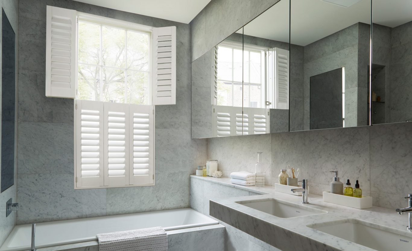 tier on tier plastic window shutters in bathroom