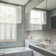 tier on tier plastic window shutters in bathroom