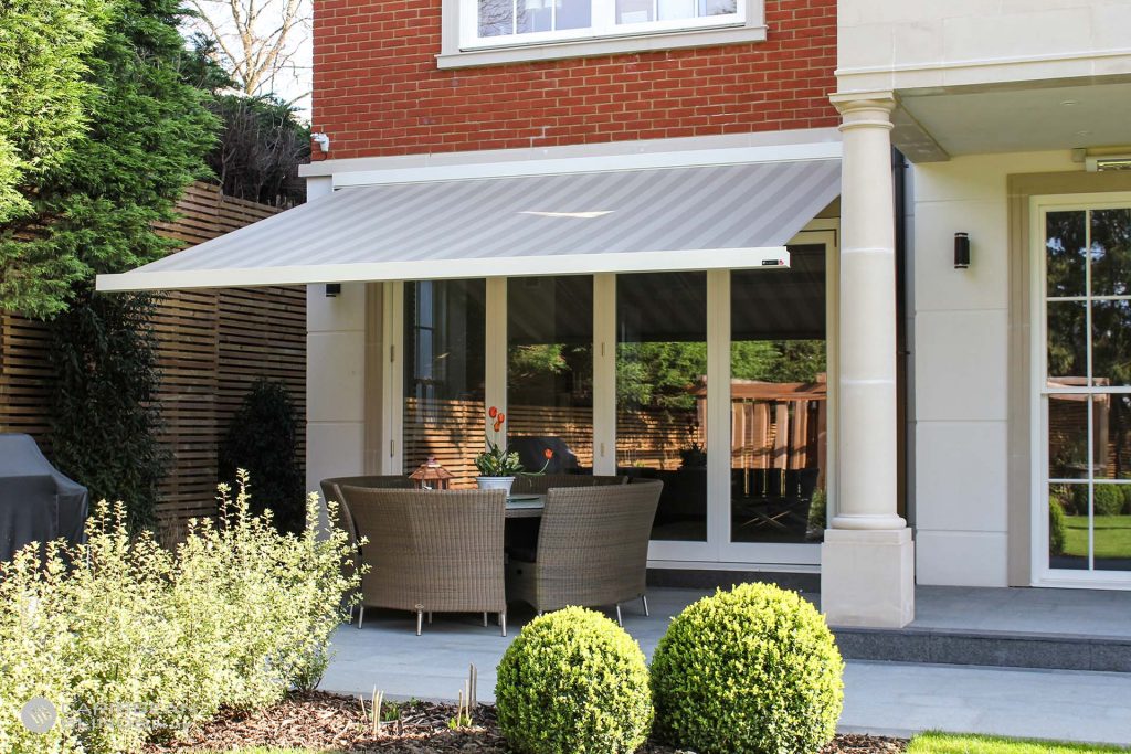 Black vertical louvred patio door blinds in living room