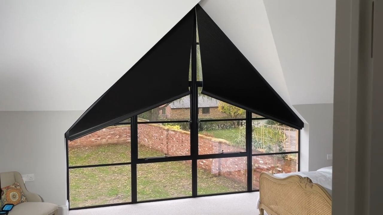 Motorised apex blinds in a triangular window